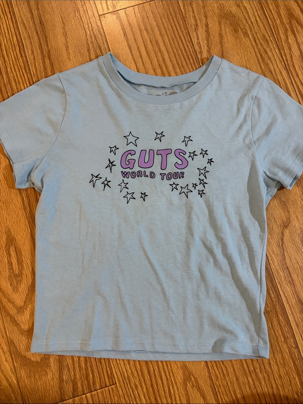 Light Blue Crop Tee with Purple 'GUTS' Graphic